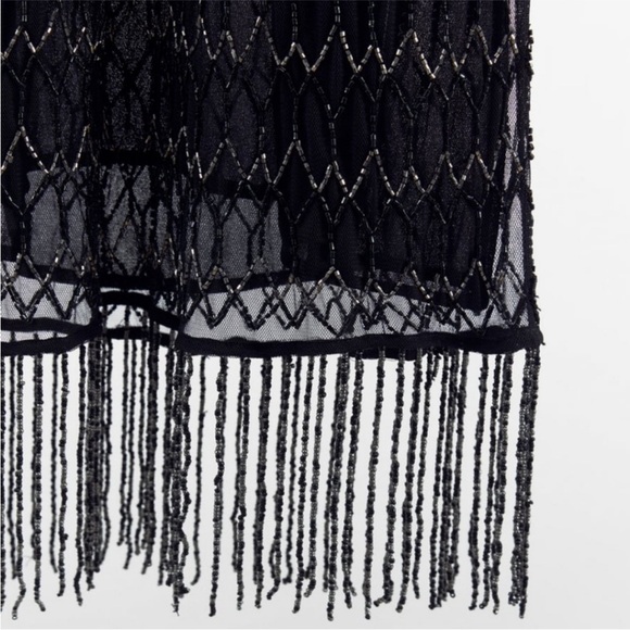 Zara Black Embroidered and Beaded
Fringe Midi Dress
$70 Size: S
Zara
NWT - Picture 5 of 5